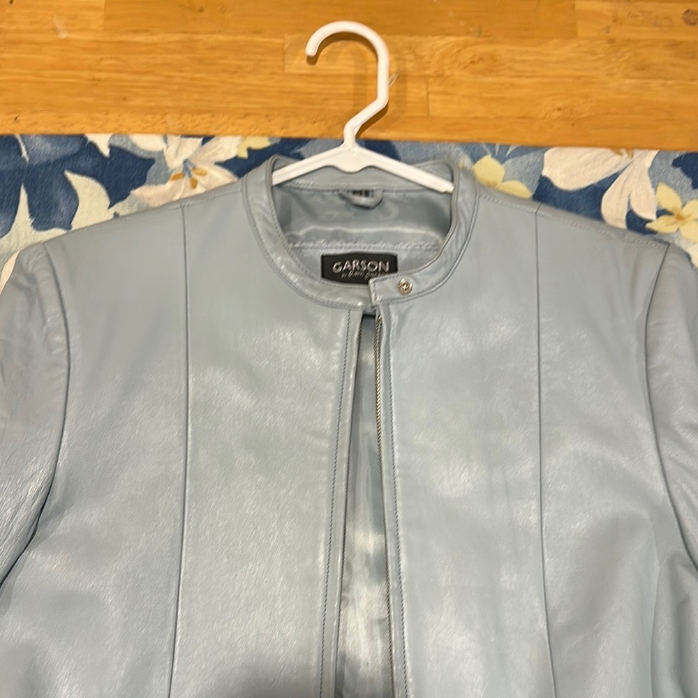 Sleek Blue Leather Jacket with Seam Detailing and Zipper